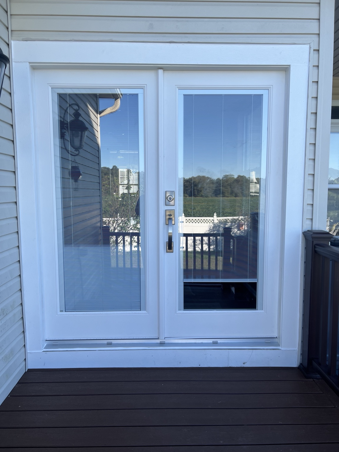 Completed double patio door installation with white finish trim